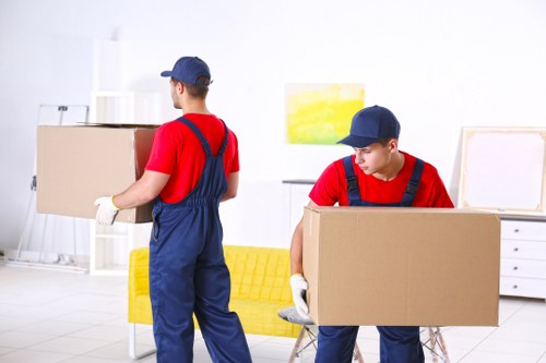 Storage facility staff sorting recyclable cardboard and packing materials