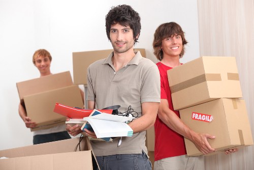 Staff member examining a storage complaints file during a detailed review