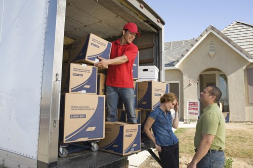 Packed boxes and furniture prepared for a small removal service