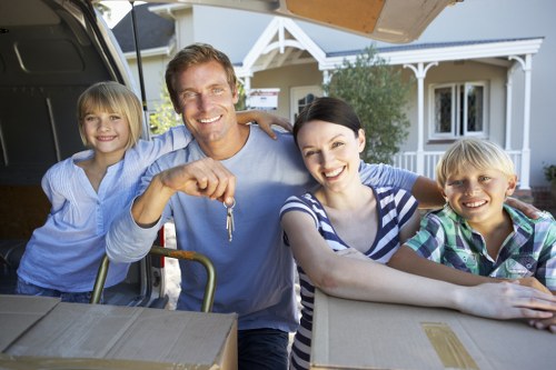 Professional movers handling furniture during a small removals job
