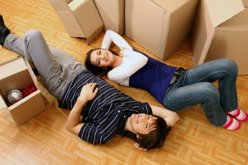 Professional movers handling furniture during house removals